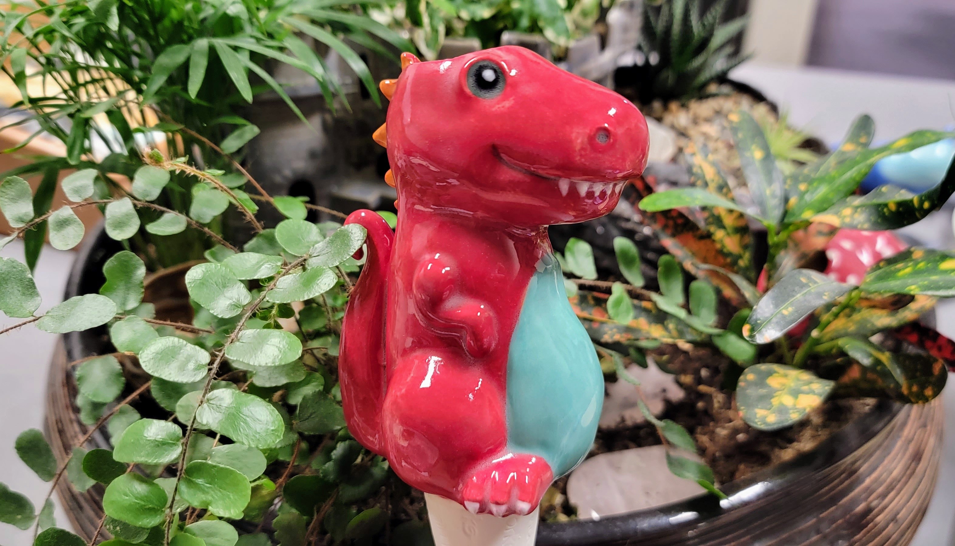 dinosaur self watering plant Dinosaur Watering Spike Red
