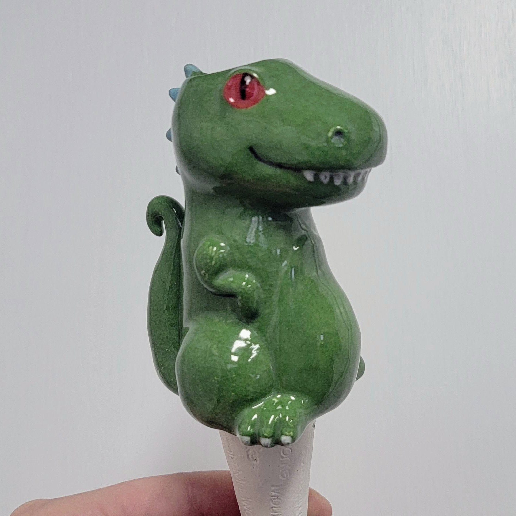 self watering dinosaur planter Dinosaur Watering Spike Reptar